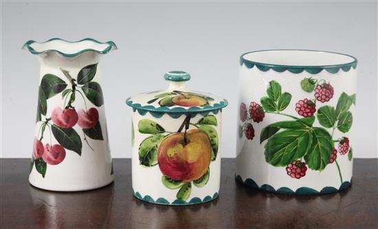 A Wemyss preserve pot and cover, a similar vase and a cylindrical pot, early 20th century, 12cm, preserve cover with restorations